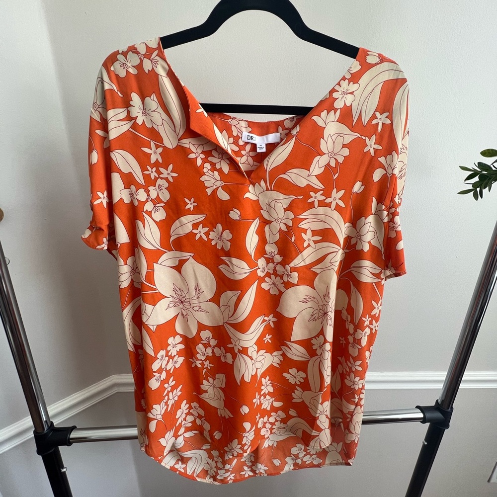 women’s orange and white floral blouse